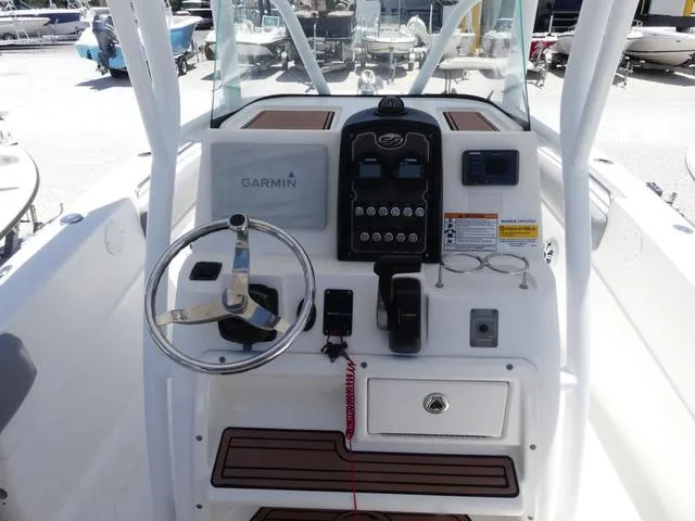 Slide: The Image of 2017 Sea Fox 246 Commander boat console with Garmin navigation system and steering wheel. - 9