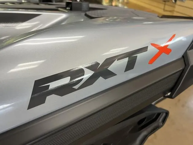 Slide: The Image of 2024 Sea-Doo Waverunner RXT model, close-up of sleek silver design and logo. - 5