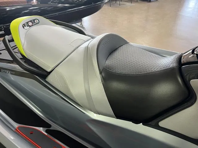 Slide: The Image of 2024 Sea-Doo Waverunner RXT with sleek black and gray seating design. - 6