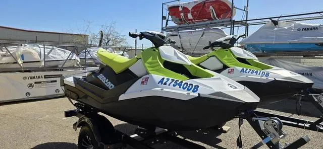 Slide: The Image of 2023 Sea-Doo Spark 3-Up Rotax 900 ACE jet skis on a trailer, ready for adventure. - 6