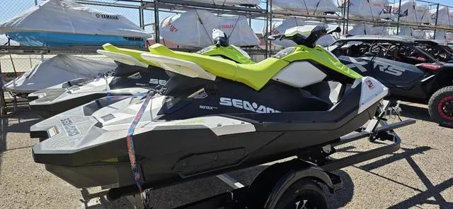 Slide: The Image of 2023 Sea-Doo Spark 3-Up Rotax 900 ACE Waverunner on trailer, vibrant yellow and black design. - 9