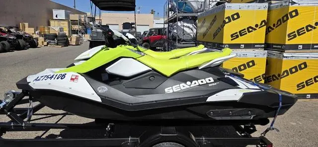 Slide: The Image of 2023 Sea-Doo Spark 3-Up Rotax 900 ACE Waverunner in a showroom setting. - 5
