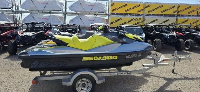 Slide: The Image of 2022 Sea-Doo GTI SE 130 iBR Waverunner on trailer, surrounded by off-road vehicles. - 6
