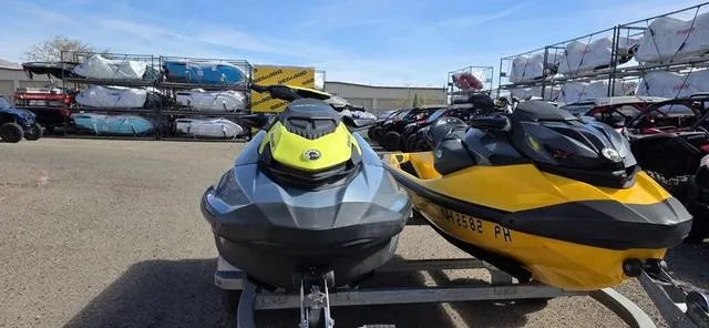 Slide: The Image of 2022 Sea-Doo Waverunner GTI SE 130 iBR parked outdoors, with other watercraft in the background. - 7