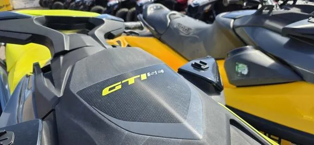 Slide: The Image of 2022 Sea-Doo Waverunner GTI SE 130 iBR, close-up of sleek design and logo. - 9