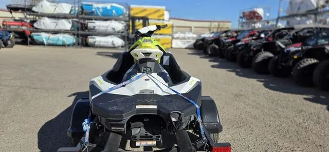 Slide: The Image of 2023 Sea-Doo Waverunner Spark 3-Up Rotax 900 ACE on trailer in outdoor lot. - 3