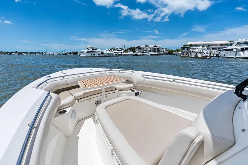 Slide: The Image of 2020 Boston Whaler 280 Outrage boat interior with waterfront view. - 13