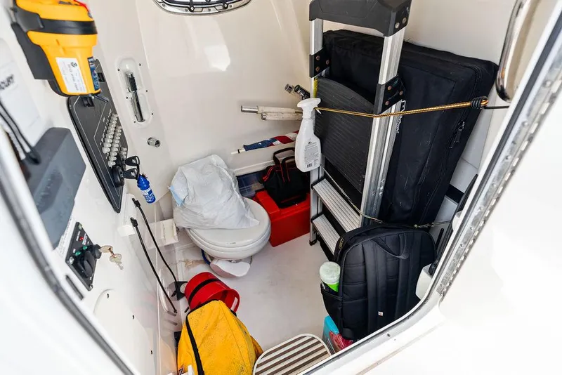 Slide: The Image of Interior of 2020 Boston Whaler 280 Outrage boat with storage and equipment. - 15