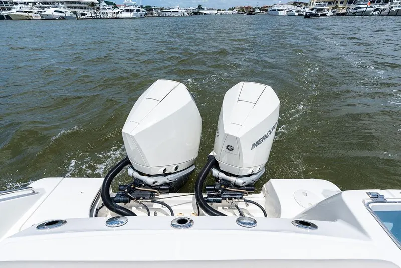 Slide: The Image of 2020 Boston Whaler 280 Outrage with dual Mercury outboard engines on water. - 18