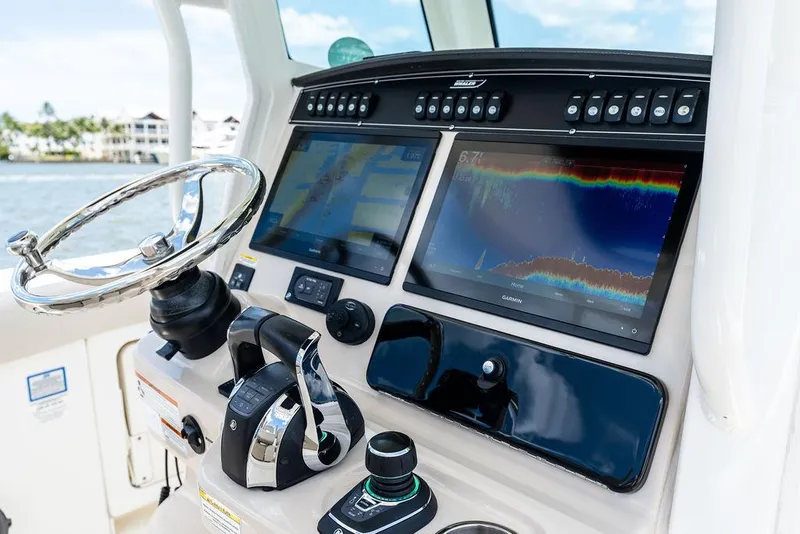 Slide: The Image of Control panel of a 2020 Boston Whaler 280 Outrage with advanced navigation displays. - 22