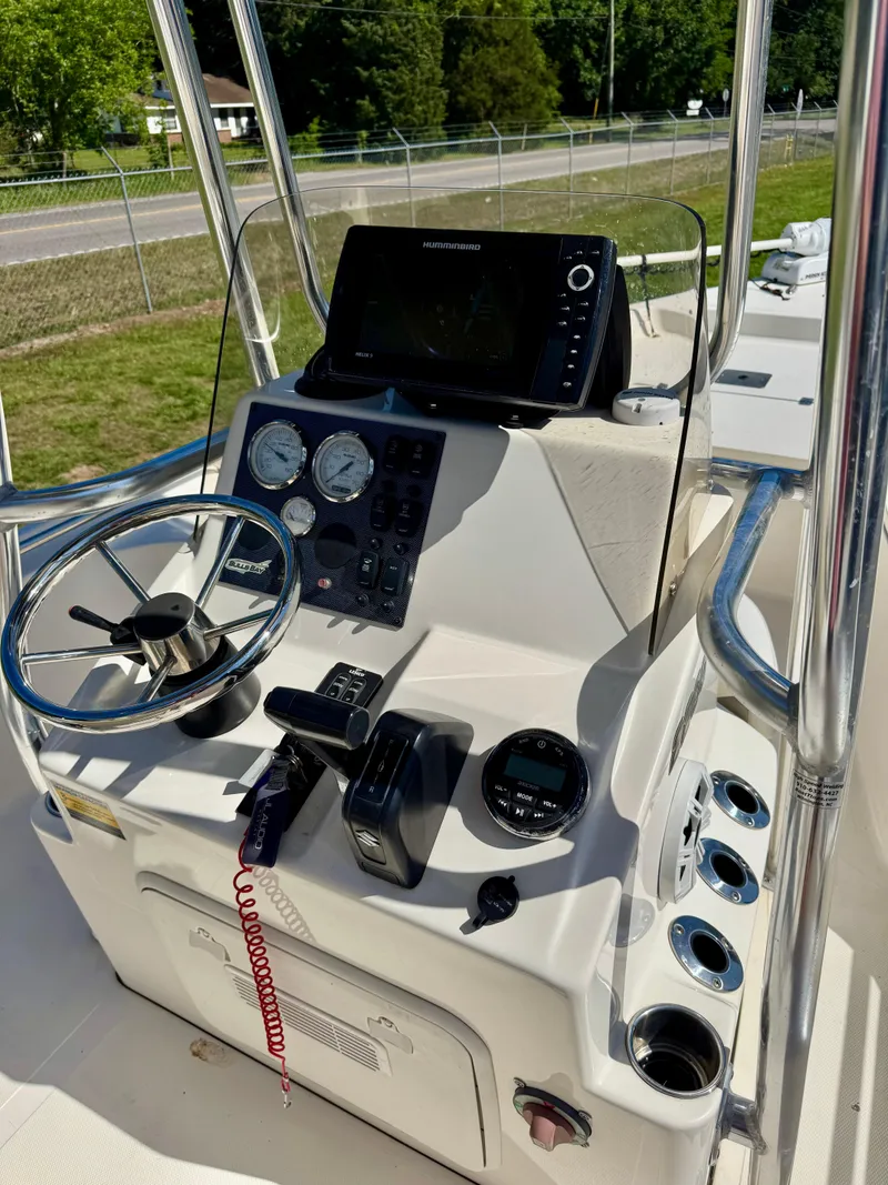 Slide: The Image of 2018 Bulls Bay 2200 boat console with steering wheel and navigation equipment. - 10