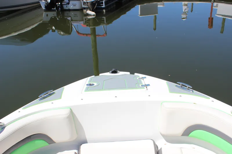 Slide: The Image of 2017 Chaparral Vortex 2430 VRX boat docked in calm marina waters. - 26