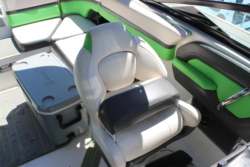 Slide: The Image of 2017 Chaparral Vortex 2430 VRX boat interior with green accents and seating. - 30