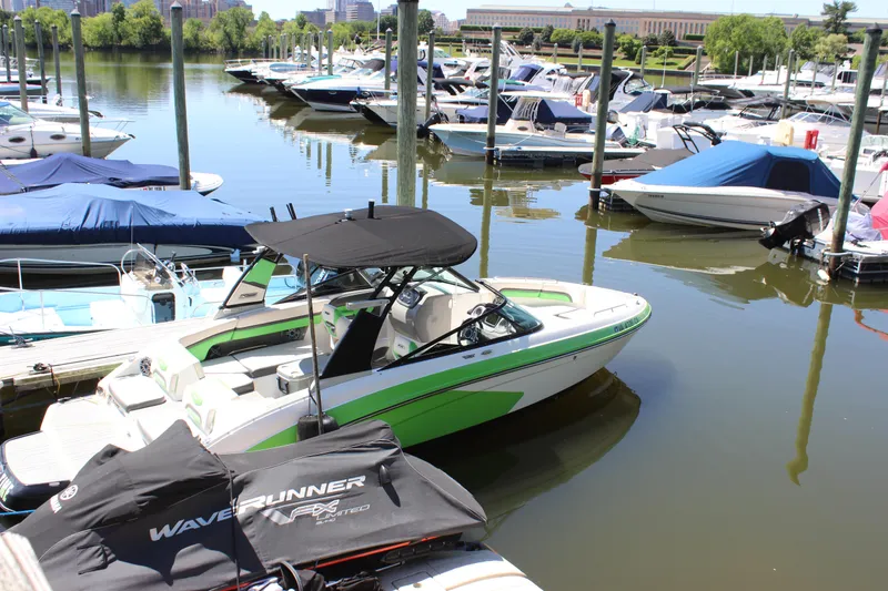 Slide: The Image of 2017 Chaparral Vortex 2430 VRX boat docked in a marina with other vessels. - 33