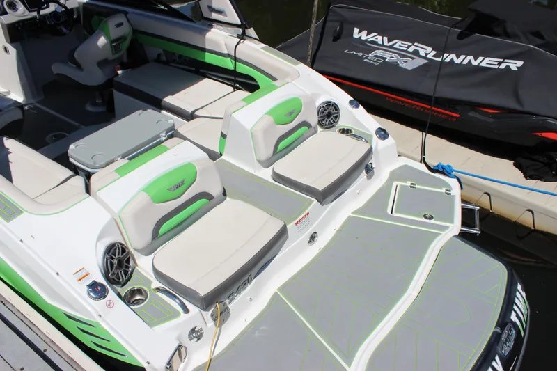 Slide: The Image of 2017 Chaparral Vortex 2430 VRX boat with green accents and spacious seating. - 4
