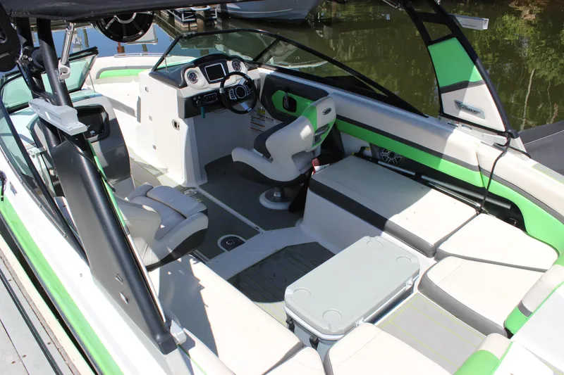 Slide: The Image of 2017 Chaparral Vortex 2430 VRX boat interior with green accents and seating. - 5