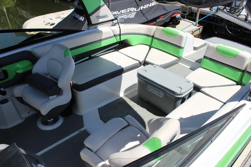 Slide: The Image of 2017 Chaparral Vortex 2430 VRX boat interior with green accents and seating. - 7