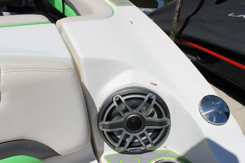 Slide: The Image of 2017 Chaparral Vortex 2430 VRX boat interior with speaker and seating detail. - 9