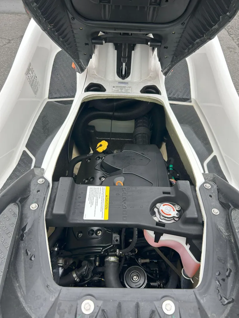 Slide: The Image of 2015 Sea-Doo GTX 155 engine compartment with open hood, showcasing internal components. - 20