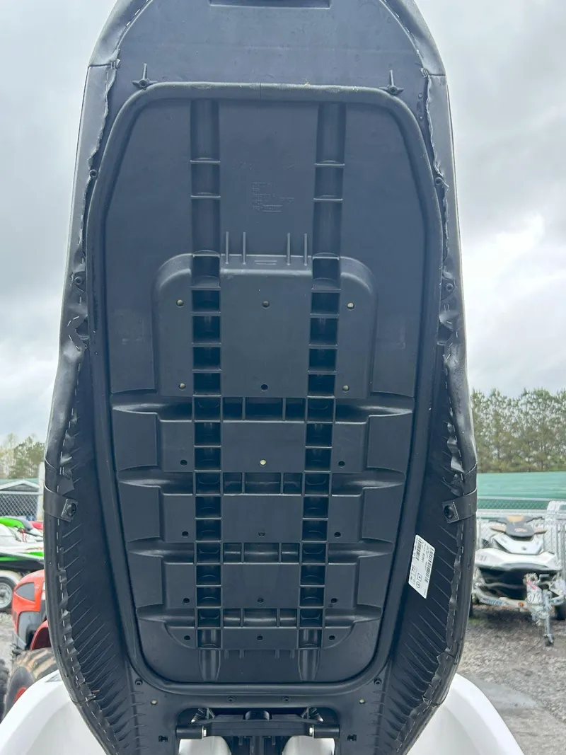 Slide: The Image of Underside view of a 2015 Sea-Doo GTX 155 jet ski, showcasing its hull design. - 21