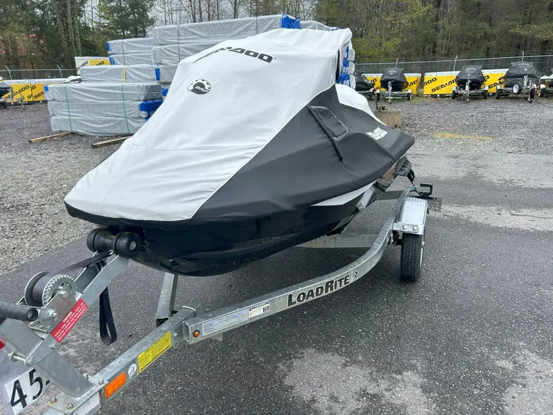 Slide: The Image of 2015 Sea-Doo GTX 155 on Load Rite trailer, covered, in outdoor storage area. - 22
