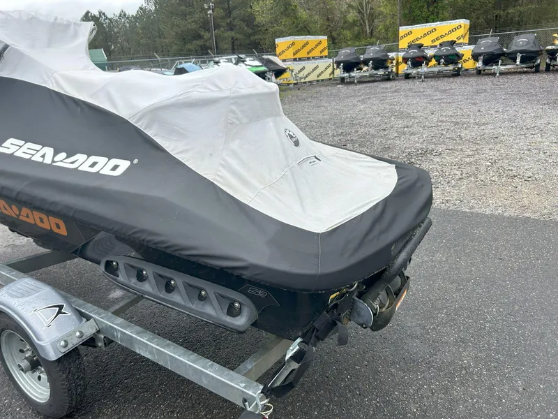 Slide: The Image of Covered 2015 Sea-Doo GTX 155 on trailer in parking lot. - 23