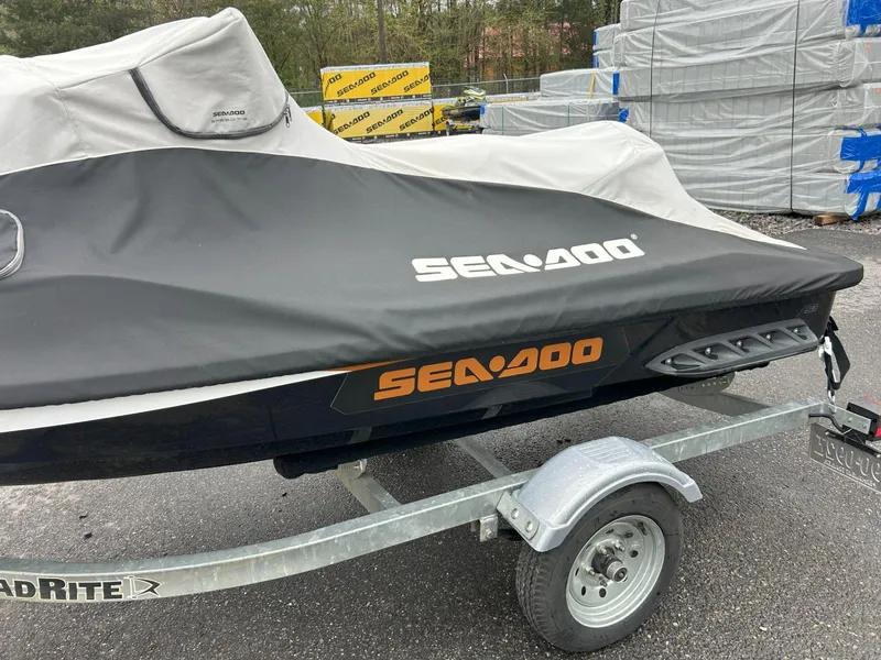 Slide: The Image of Covered 2015 Sea-Doo GTX 155 on trailer, parked outdoors. - 24
