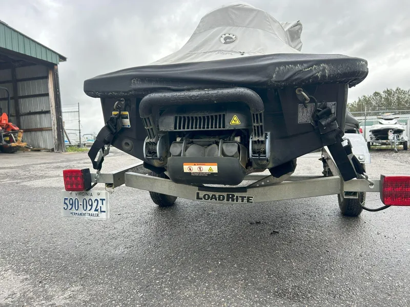 Slide: The Image of 2015 Sea-Doo GTX 155 on Load Rite trailer, covered, parked outdoors. - 26