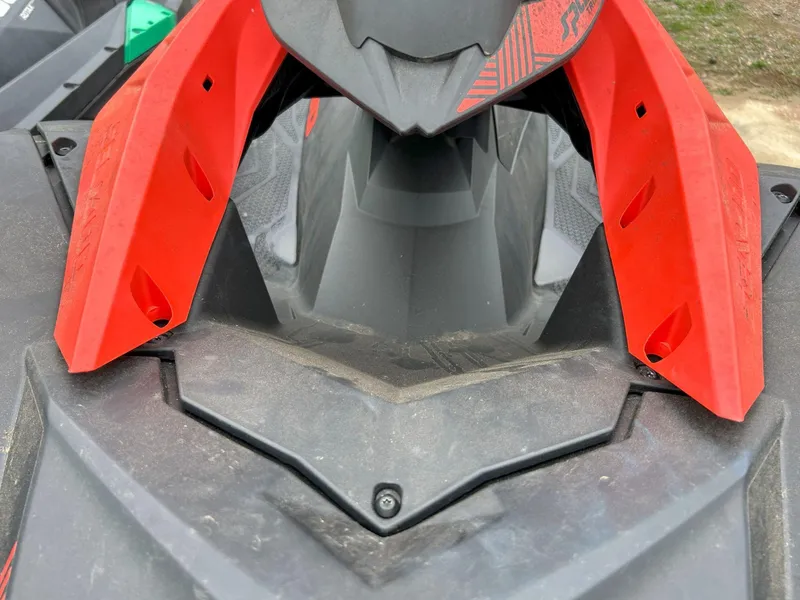 Slide: The Image of 2021 Sea-Doo Spark Trixx 3up iBR with vibrant red accents, close-up view. - 4