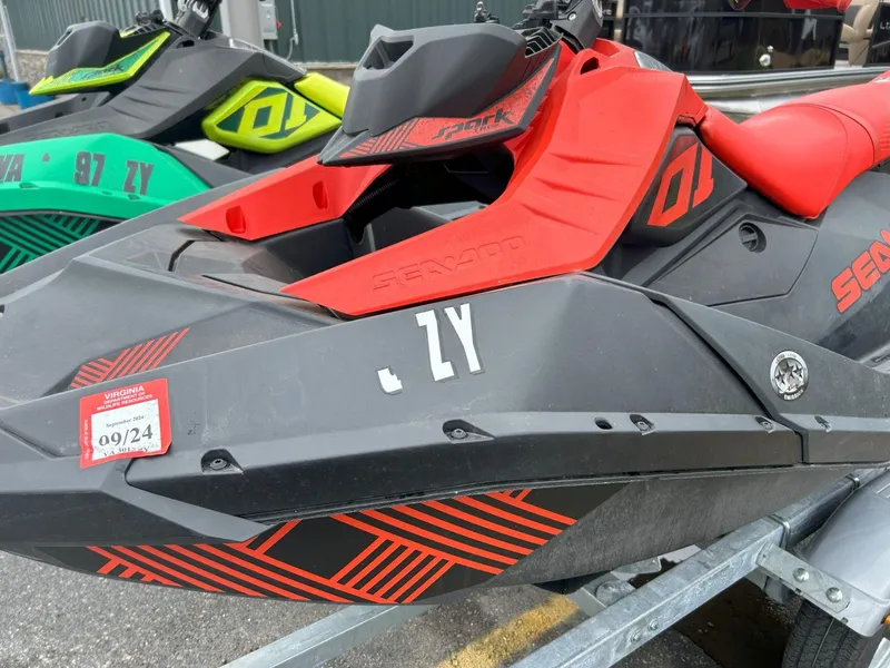 Slide: The Image of 2021 Sea-Doo Spark Trixx 3up iBR with sound system, red and black design on trailer. - 6