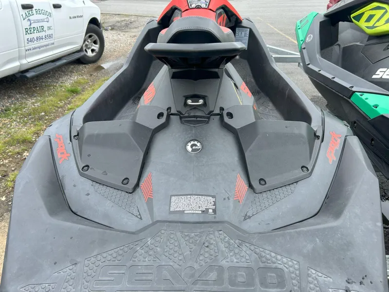 Slide: The Image of 2021 Sea-Doo Spark Trixx 3up iBR with sound system, parked outdoors. - 8