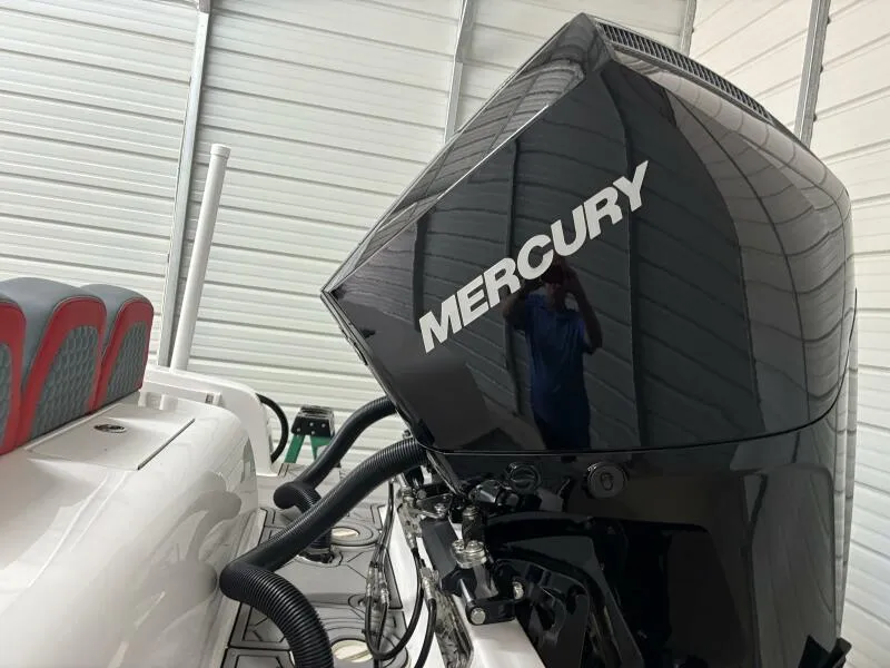 Slide: The Image of 2025 Concept 27' Open Deck boat with Mercury outboard engine in a garage. - 10