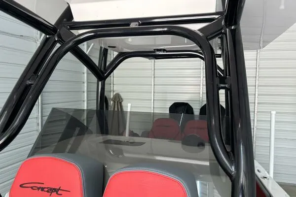 Slide: The Image of 2025 Concept 27' Open Deck boat interior with red seats and black frame. - 11