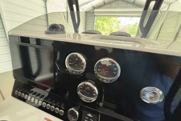 Slide: The Image of 2025 Concept 27' Open Deck dashboard with gauges and controls in a covered area. - 14