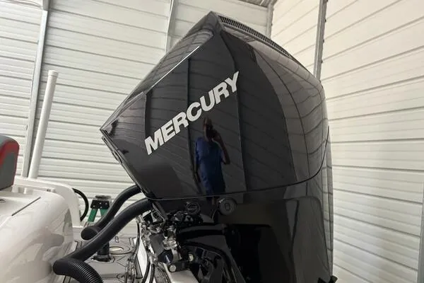 Slide: The Image of Mercury outboard motor on 2025 Concept 27' Open Deck boat in storage. - 28