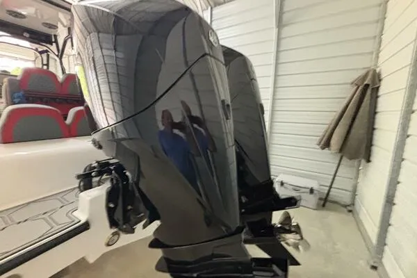 Slide: The Image of 2025 Concept 27' Open Deck boat with dual outboard motors in a garage setting. - 30