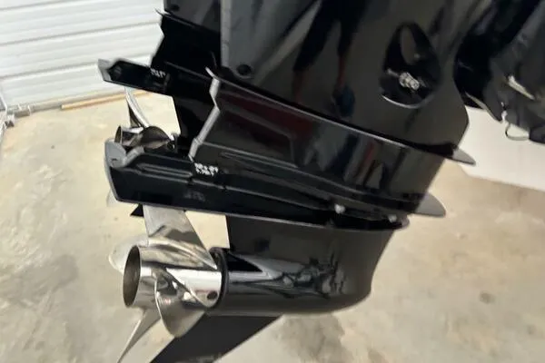 Slide: The Image of 2025 Concept 27' Open Deck boat engine with sleek black finish and stainless steel propeller. - 32