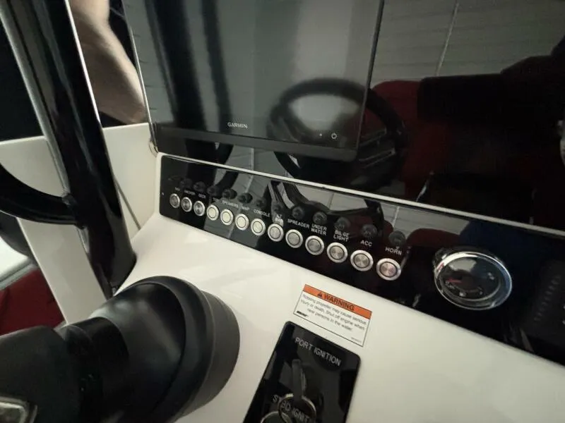 Slide: The Image of Control panel of 2025 Concept 27' Open Deck boat with Garmin display and buttons. - 36