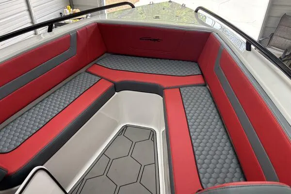 Slide: The Image of 2025 Concept 27' Open Deck boat interior with red and gray seating, hexagonal floor pattern. - 39