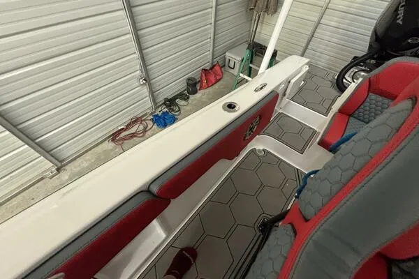 Slide: The Image of 2025 Concept 27' Open Deck boat interior with red and gray seating, hexagonal flooring. - 41