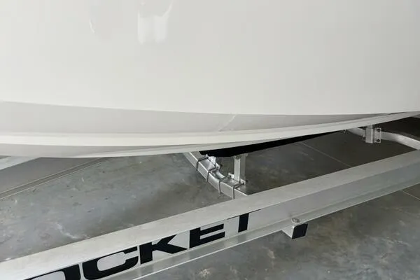 Slide: The Image of 2025 Concept 27' Open Deck boat on a Rocket trailer in a garage. - 43