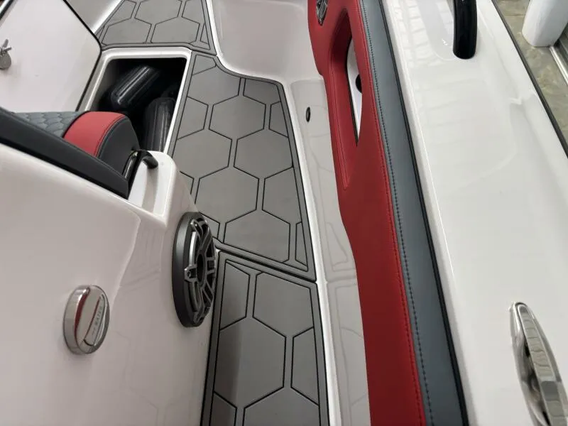 Slide: The Image of Interior of 2025 Concept 27' Open Deck boat with hexagonal flooring and red accents. - 47