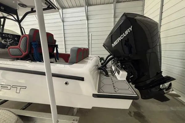 Slide: The Image of 2025 Concept 27' Open Deck boat with Mercury engine in storage facility. - 5