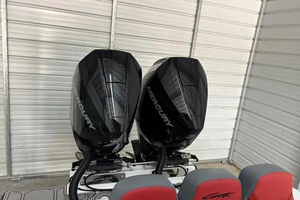 Slide: The Image of Twin Mercury outboard engines on a 2025 Concept 27' Open Deck boat in a garage. - 6