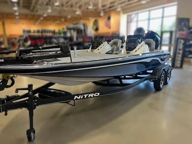 Slide: The Image of 2024 Nitro Z20 Pro boat displayed indoors on a trailer. - 0