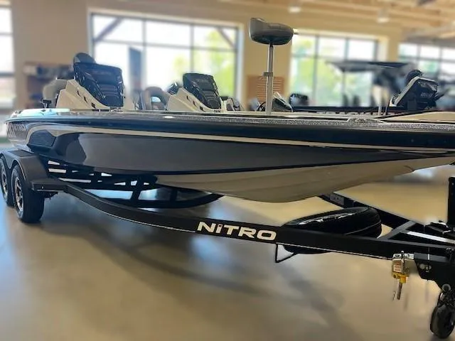 Slide: The Image of 2024 Nitro Z20 Pro boat on display in a showroom. - 3