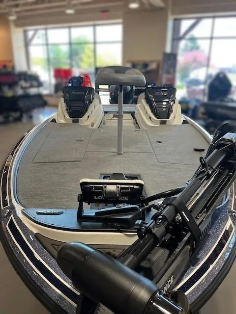 Slide: The Image of 2024 Nitro Z20 Pro fishing boat with advanced equipment in a showroom setting. - 5