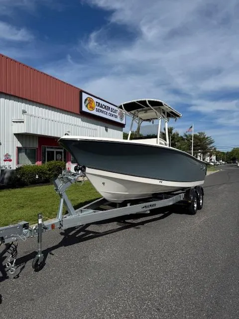 Slide: The Image of 2025 Mako 214 CC boat on trailer outside Tracker Boat Service Center. - 6