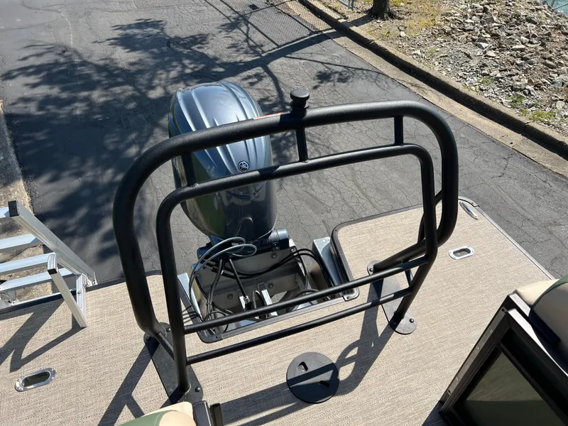 Slide: The Image of 2025 Godfrey Sweetwater 2286 Tri-Toon boat with motor and safety railing. - 18