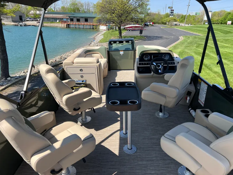 Slide: The Image of Interior of 2025 Godfrey Sweetwater 2286 Quad Social Tri-Toon with beige seating and table. - 20